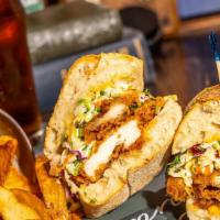 The Crispy Flying Cock Sandwich · Fried chicken, jalapeño slaw, spicy mayo on a ciabatta hero served with hand cut french frie...