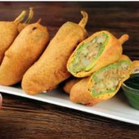 Bindass Mirchi Bhajiya · Long hot kali mrichi stuffed with tamarind and potatoes spices.
