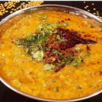 Dal Tadka · Cooked lentils which are lastly tempered with ghee fried spices and herbs.