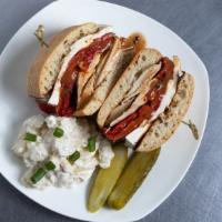 The Chicken Caprese · Grilled chicken, roasted red peppers, sun-dried tomatoes, fresh mozzarella with balsamic dre...