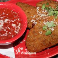 Fried Mozzarella · Fried mozzarella wedges served with red sauce.