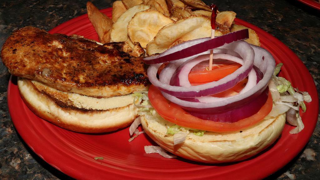 Chicken Sandwich · Served on a soft roll with lettuce, tomato, and onion.