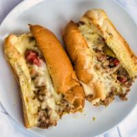 Philly Steak Sub · Most popular.  Philly style steak sub made with caramelized onions, roasted peppers, mushroo...