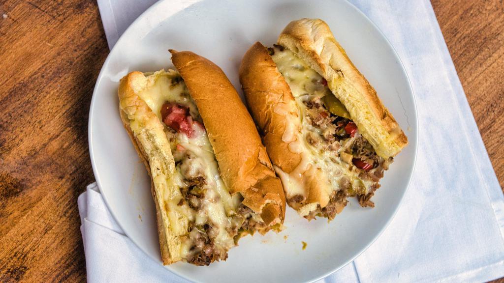 Philly Steak Sub · Most popular.  Philly style steak sub made with caramelized onions, roasted peppers, mushrooms and toasted with Mozzarella cheese.