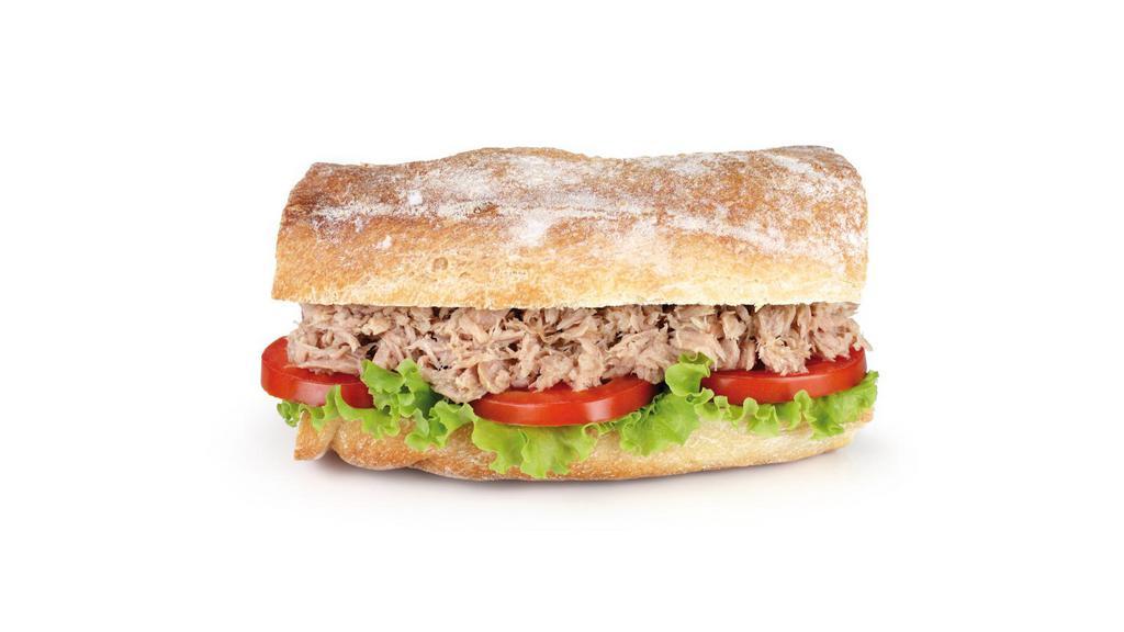 Tuna Sandwich · Delicious Sandwich made with Tuna, lettuce, tomato, onion and mayo on a baguette. Served with French Fries.
