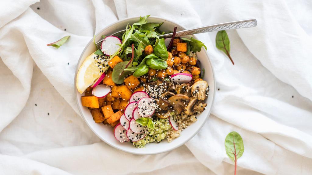 Quinoa Bowl Salad · Fresh Salad made with Diced tomato, cucumber, roasted Brussels sprouts, caramelized sweet potatoes, shaved fennel, tahini vinaigrette and arugula.