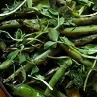 Blistered Green Beans And Shishito Peppers · Tossed in a house made rayu chili oil and served with a lime miso vinaigrette