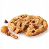 Pecan Turtle Cookies · This delightfully rich, freshly baked cookie combines caramel with pecans and semi-sweet cho...