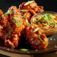Spicy Asian Bbq Tenders · Battered Chicken Tenders, tossed in Spicy Asian BBQ Sauce, with a side of our House Made Spi...