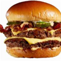 Ny Attitude Burger · 1/2 lb. Fresh Angus Beef, Bacon, Pickles, Bistro Sauce, Caramelized Onions, and American Che...