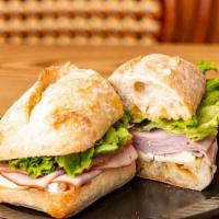 #5 Sandwich - Ham & Brie · Black forest ham & brie cheese with honey mustard, lettuce on french baguette.