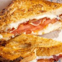Grilled Cheese With Bacon · american cheese, applewood smoked bacon, tomato on country white bread. ***Sandwiches are he...