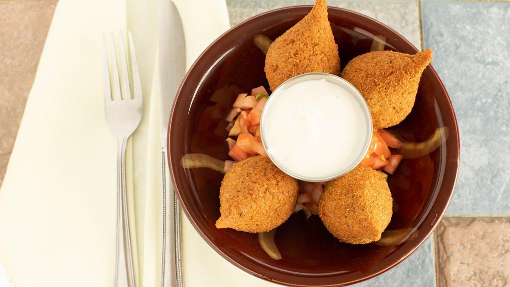 Kibbeh Balls · A meat shell stuffed with ground meat and pine nuts.