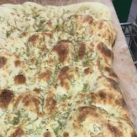 Focaccia Bianca 1/2 Tray · Our signature focaccia with rosemary and extra virgin olive oil.