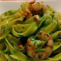 Tagliatelle Pesto & Shrimp · Fresh tagliatelle, basil pesto, almonds and shrimp.