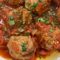 Braised Beef Meatballs · In homemade san marzano tomato sauce.