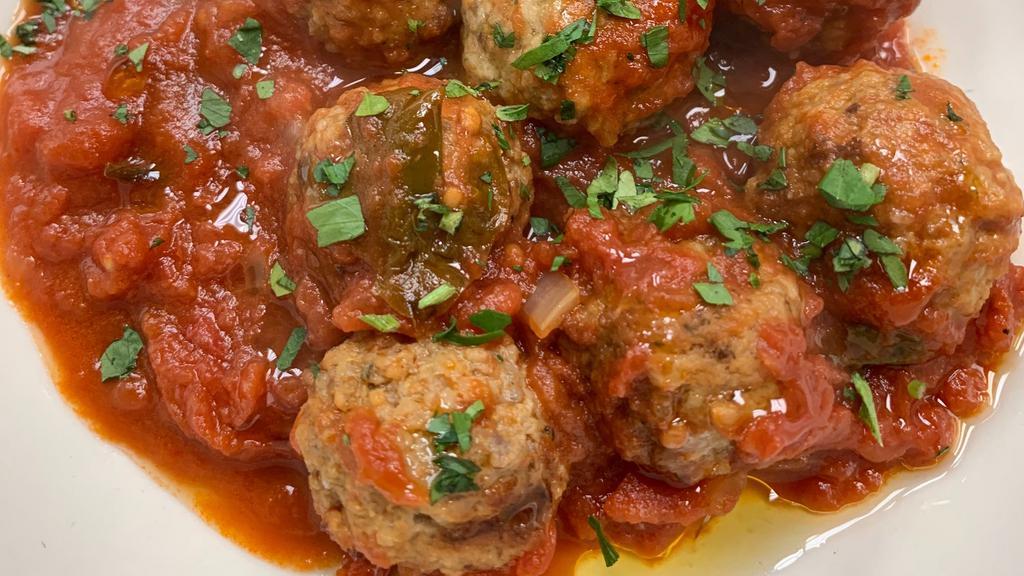 Braised Beef Meatballs · In homemade san marzano tomato sauce.