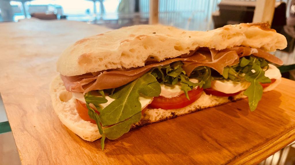 Parma · Prosciutto di Parma, arugula, tomato, mozzarella and EVOO.