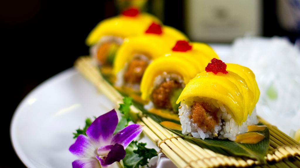 Amazing Roll · Spicy crunchy tuna and avocado inside, topped with fresh mango and tobiko.