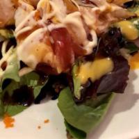 Sashimi Salad · Spring mixed salad on top with salmon, tuna, white tuna, yellowtail, avocado, mango, tobikos...