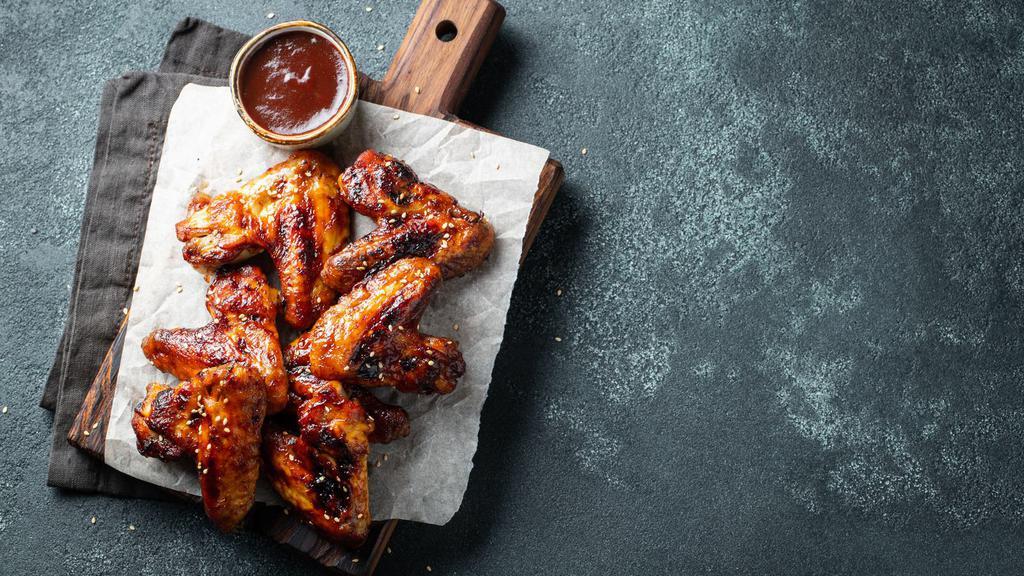 Jerk Chicken Wings · Deep fried chicken wings tossed in our fresh jerk sauce.