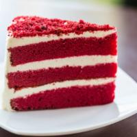 Red Velvet Cake · A slice of our fresh made delicate chocolate cake with a rich cream cheese frosting.