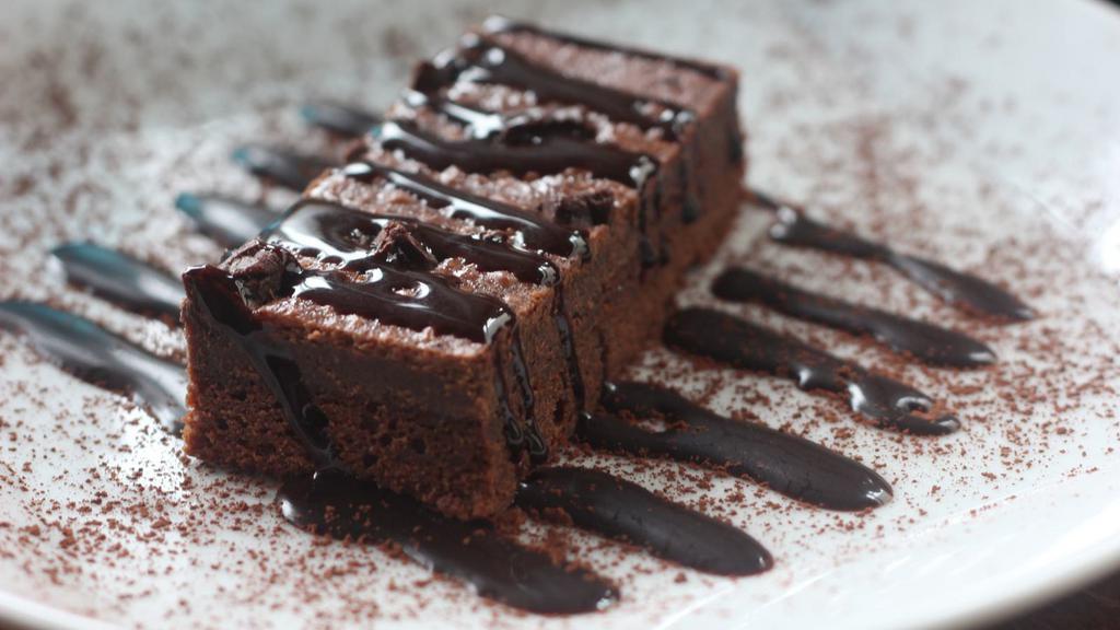 Chocolate Cake · A slice of our fresh made rich chocolate cake with a chocolate frosting.