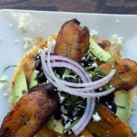 Loaded · Steak, black beans, plantains, avocado, garnished with queso fresco, red onion, and cilantro.