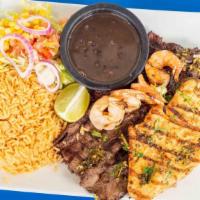 Mar Y Tierra · Grilled skirt steak, undefined, shrimp, with salad and chimichurri sauce.