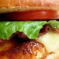 Grilled Chicken Sandwich · Organic chicken breast, smoked slab bacon, lettuce, tomato onions chipotle aioli.