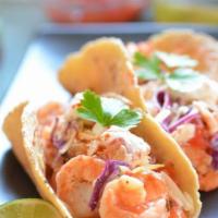 Camarones Taco · Wild caught marinated baby shrimps. Choice of Mexican-style, topped with cilantro and onions...