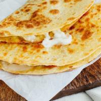 Queso Quesadilla · Served in a 8'' flour tortilla.