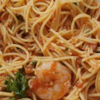 Capellini Sirenetta · Angel hair pasta with shrimp, arugula and tomato sauce.