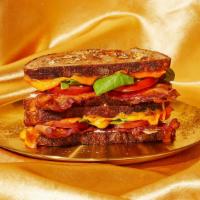 Bring Home The Bacon Blt Grilled Cheese · Crispy bacon dominates this delicious grilled cheese with lettuce, tomato, mayo, and melty g...