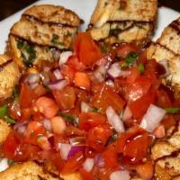 Chicken Bruschetta · Chicken cutlet topped with chopped tomato, red onions, and fresh mozzarella, in a balsamic r...