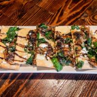 Mushroom Goat Cheese Flatbread · Herb Oil, Caramelized Onions, Mushrooms, Sauteed Spinach, Shredded Mozzarella, and Goat Chee...