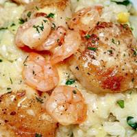 Pan Seared Jumbo Scallops · Topped with Rock Shrimp and Accompanied by Creamy Corn and Spinach Risotto, Finished with Wh...