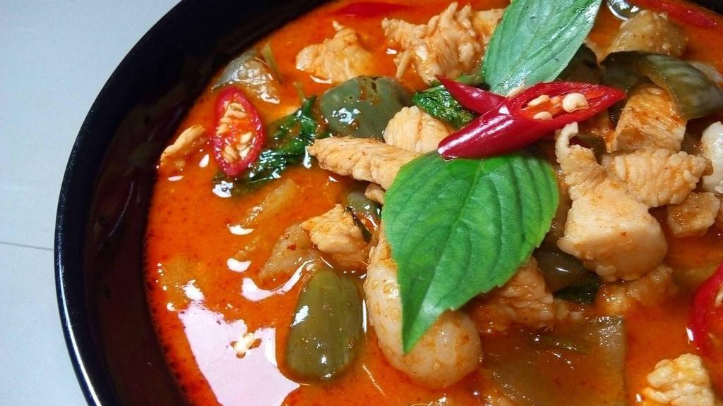 Panang Curry · Panang curry paste cooked in coconut milk with string beans and bell peppers.