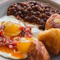 Chana & Gwaramari · Slow cook black chickpea in spice come with 2 sunny side up eggs, fried puff dough and tomat...
