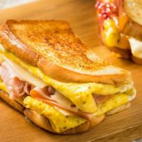 Two Eggs And Boar'S Head Meat Sandwich · Two eggs paired with a Boar's Head meat of your choice. Served in sandwich bread of your cho...
