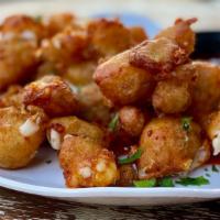 Fried Cheese Curds · Lightly breaded cheese curds, fried golden-brown made with mozzarella cheese and served with...
