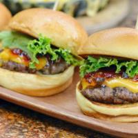 Sliders · Bite Sized Burgers Topped with Lettuce, American Cheese, ecb sauce.