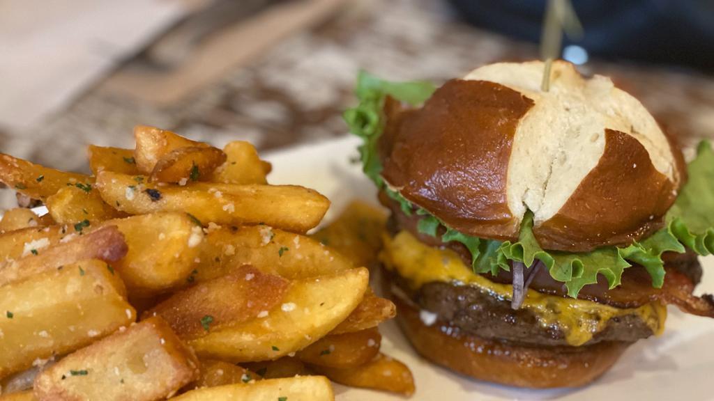 The Excalibur · Angus beef and short rib blend patty, served on a toasted brioche bun. Comes with lettuce, tomato, onion, garlic aioli and truffle steak fries. Add three toppings of choice.