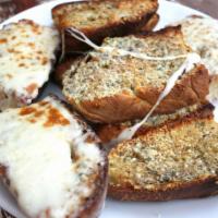 Garlic Bread  · Slices of Italian bread, thick cut with our homemade garlic butter. Add cheese for an additi...