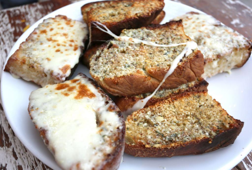 Garlic Bread  · Slices of Italian bread, thick cut with our homemade garlic butter. Add cheese for an additional charge.