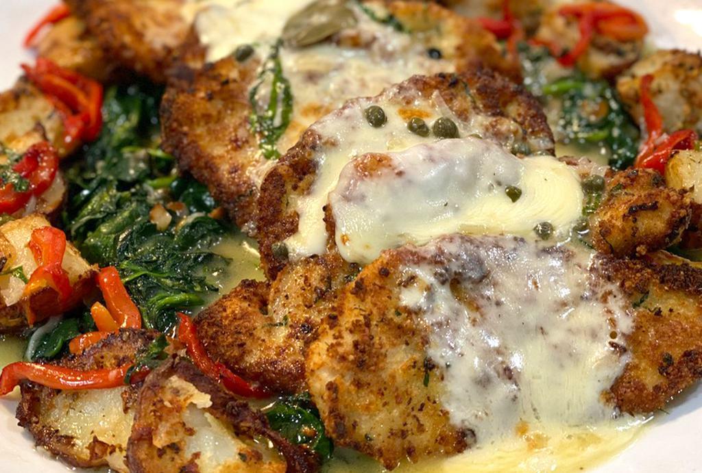 Chicken A La Romana · Breaded chicken cutlets topped with melted mozzarella cheese with roasted potatoes in a lemon butter caper sauce over sauteed spinach.