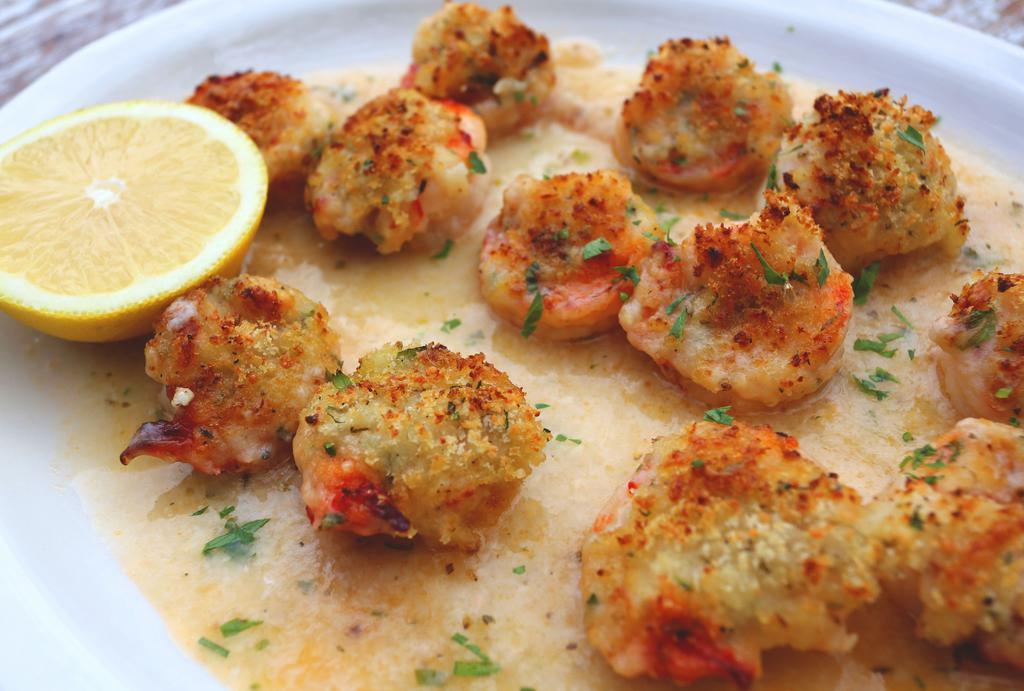 Shrimp Scampi  · Jumbo shrimp brushed with our garlic butter and topped with our seasoned breadcrumbs and baked in clam juice. Served over pasta: linguine or penne for an additional charge.