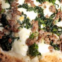 Rapini Sausage Pizza · Broccoli rabe, sausage and  fior di latte.