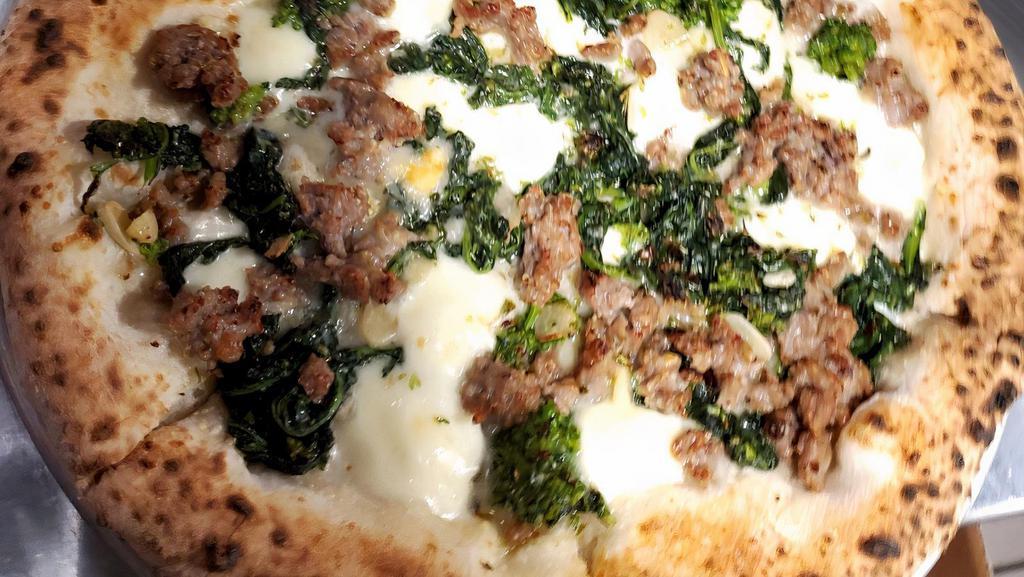 Rapini Sausage Pizza · Broccoli rabe, sausage and  fior di latte.