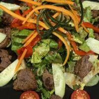 Grilled Entrecôte Salad · Iceberg lettuce, mixed greens, cherry tomatoes, roasted peppers, and grilled entrecôte
in ol...